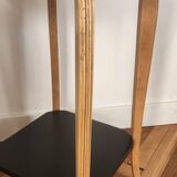 Black lacquered wooden side table with offset tops.