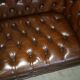 Restored Chesterfield leather sofa in vintage Art Deco style
