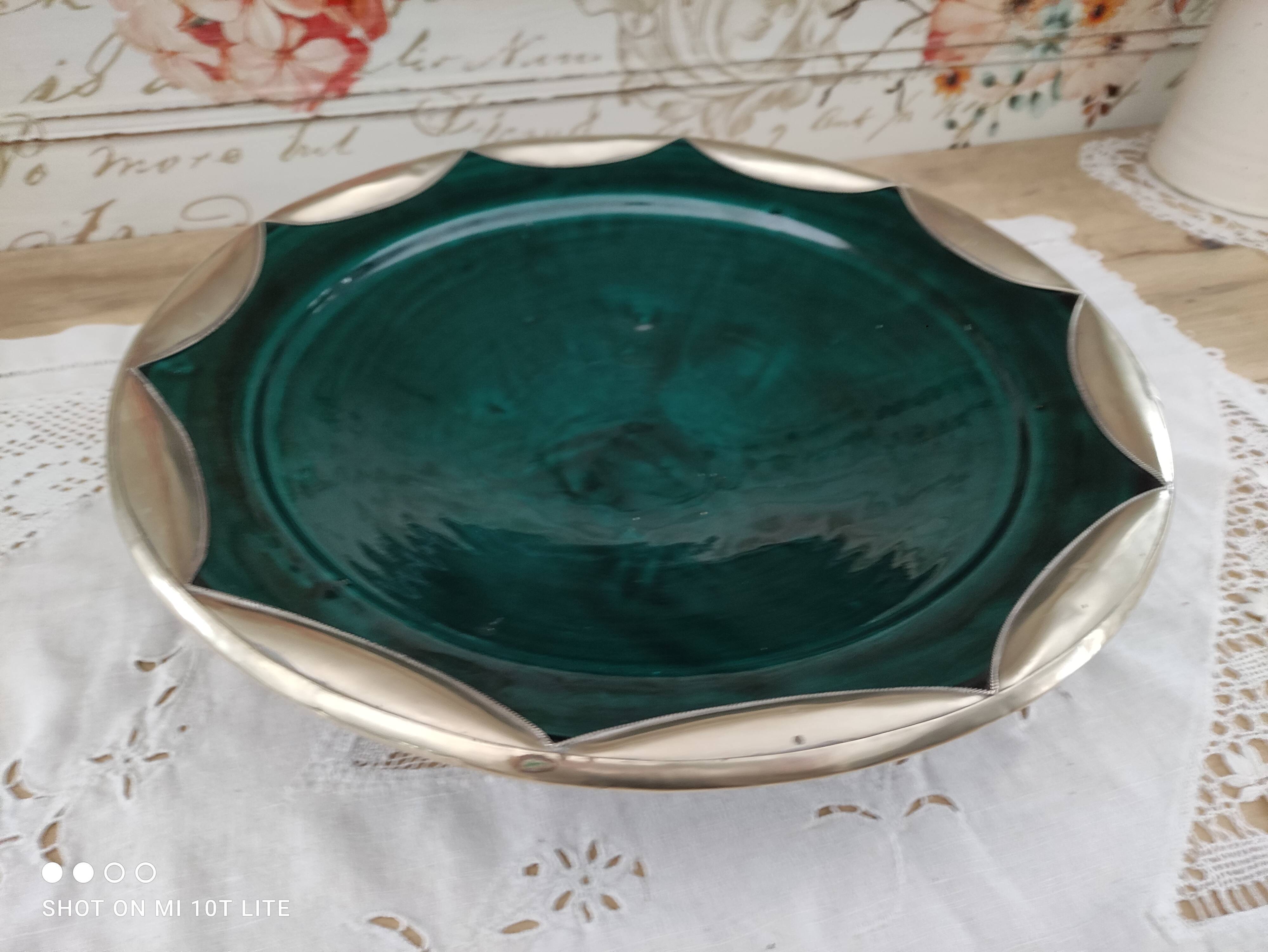 Round oriental hollow dish in deep green ceramic and silver colored metal