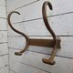 Curved wooden coat rack with 2 hooks, 1920s.