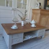 Coffee table on casters, made from an old desk, pearl gray base and belt.