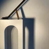 Black solid monoxyl wood bench carved into 3 arches