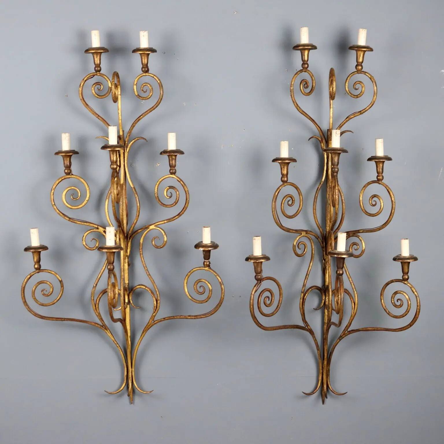 Antique wall sconces in gilded iron, 8 lights, Italy, 20th century.