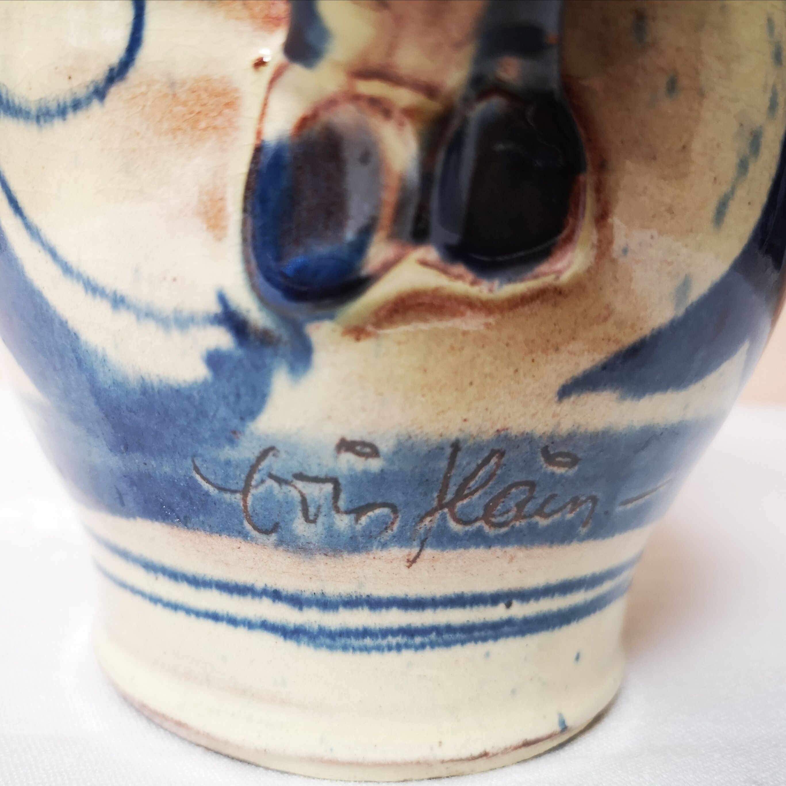 Enamelled ceramic blue pitcher signed by the artist