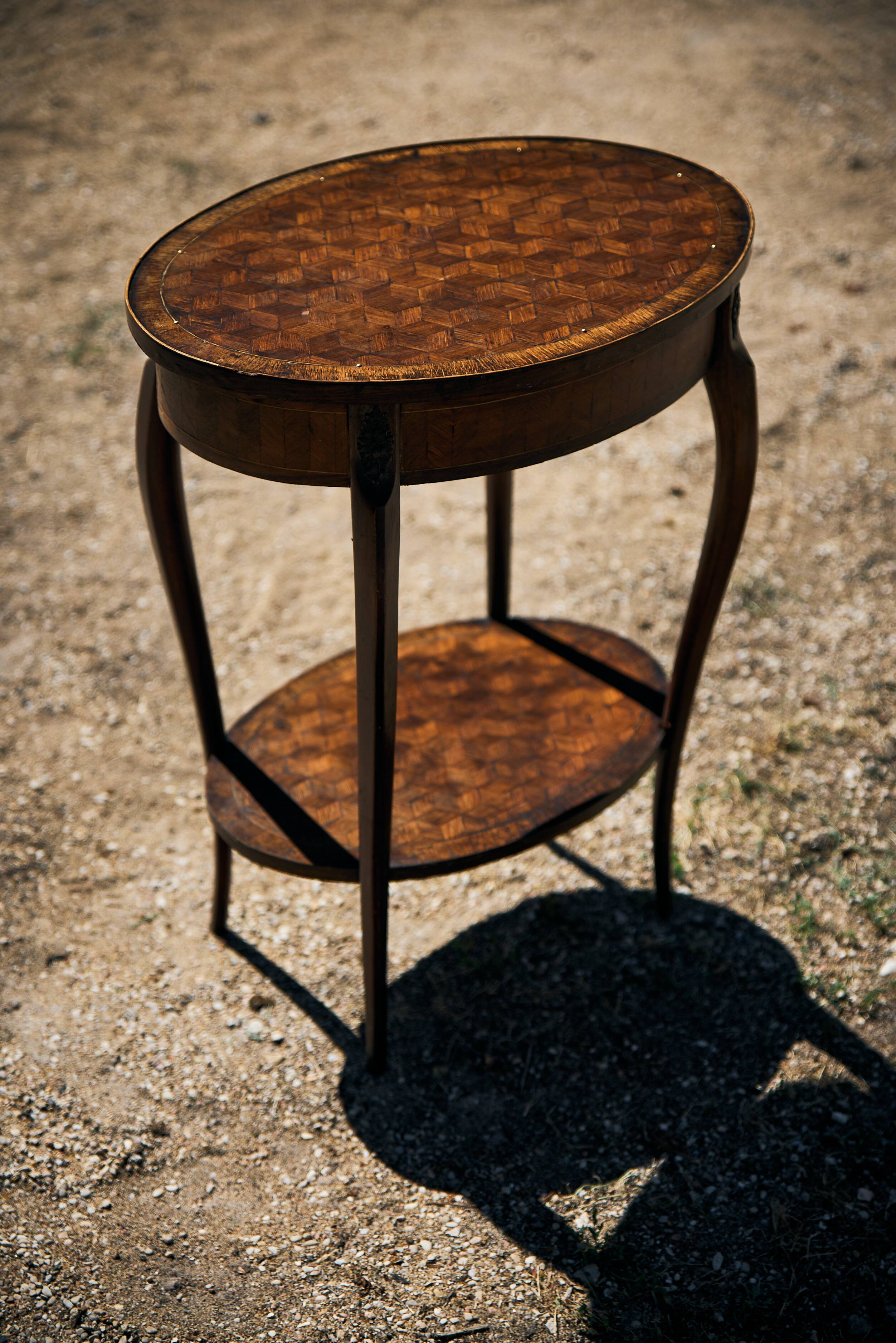 Oval coffee table in cube marquetry and bronze, Louis XV style.