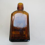 2 amber glass bottles with their old labels