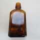 2 amber glass bottles with their old labels