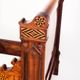 Bed made of solid walnut with marquetry details. France, 1930s.