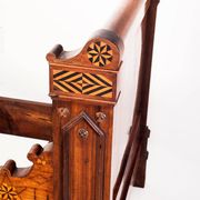Bed made of solid walnut with marquetry details. France, 1930s.