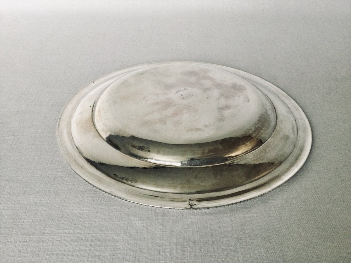 Solid silver dish with old man