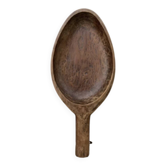 Ethnic artisanal spoon dish in wabi sabi wood