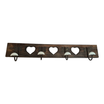wooden coat rack with porcelain hearts and hooks