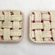 Woven pair of bottle coasters, in pink Vallauris earthenware.