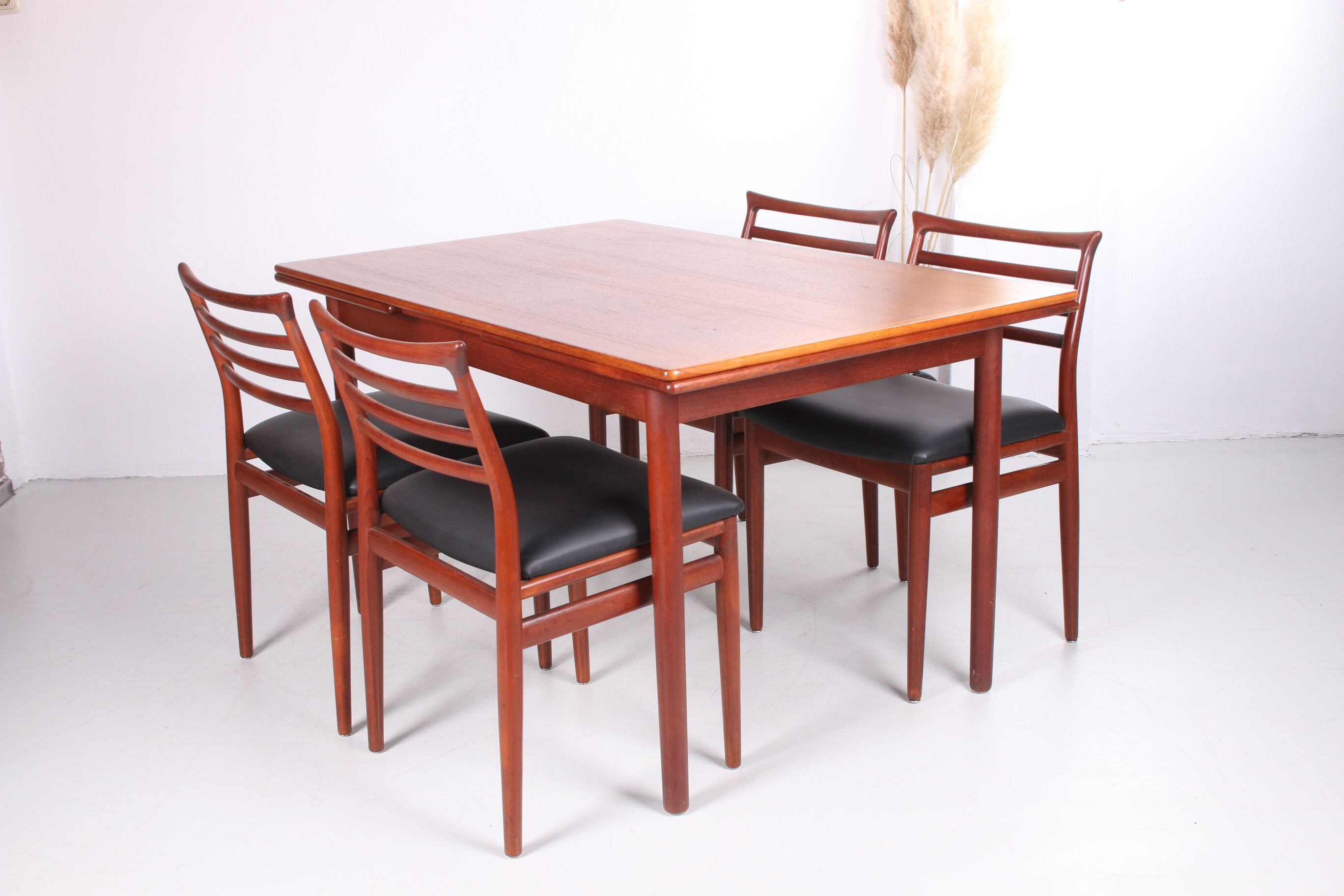 Danish teak draw-leaf dining table