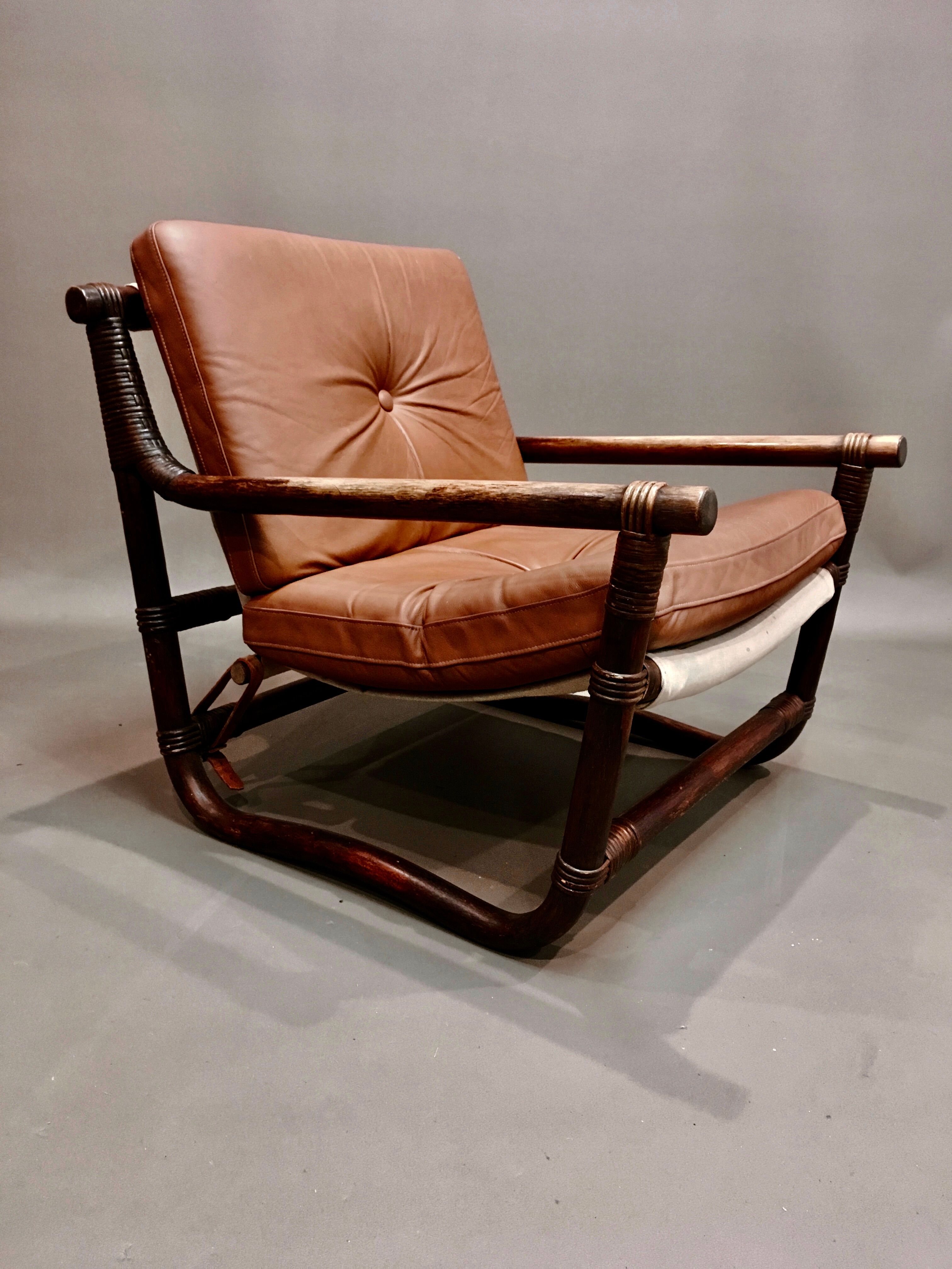 Fauteuil et son ottoman rotin et cuir 1950