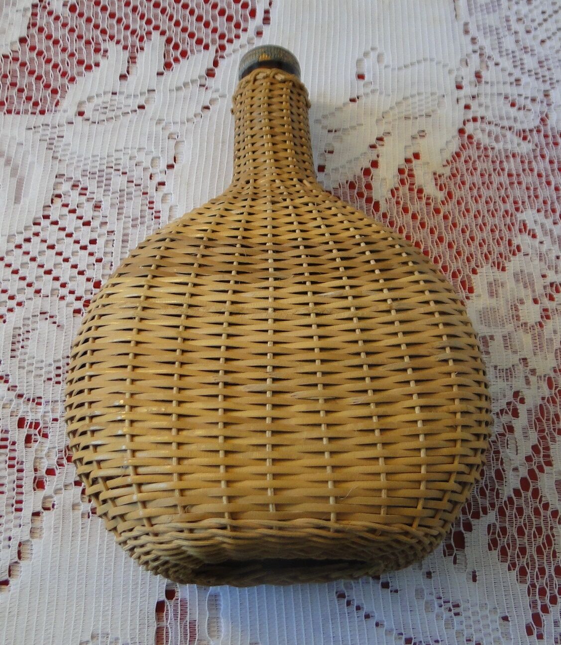 Vintage wicker covered flat bottle