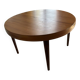 Butterfly table in teak with 2 extensions.