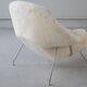 Womb Chair and Ottoman in fluffy white fabric by Eero Saarinen