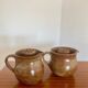 Large antique brown glazed stoneware jug with cork stopper.