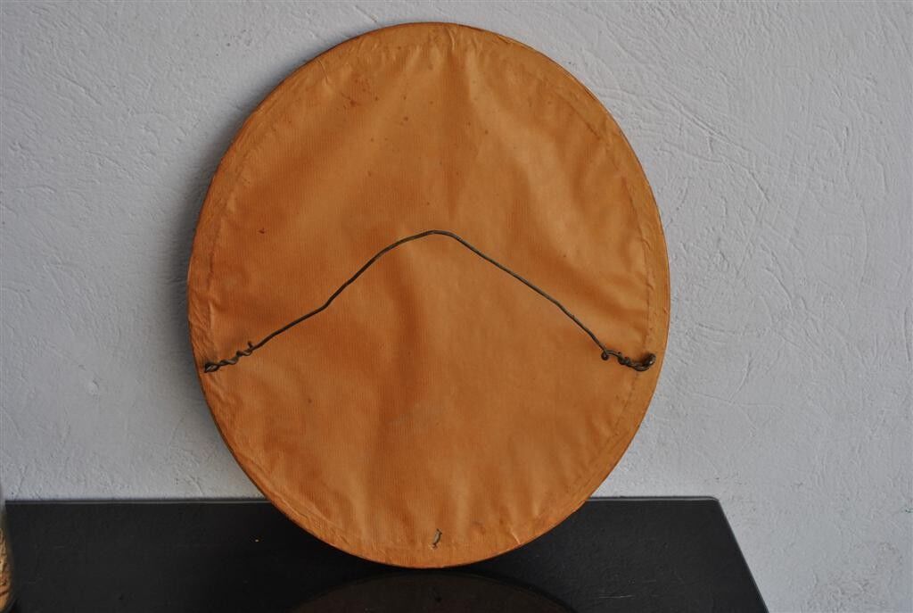 Golden stucco oval mirror