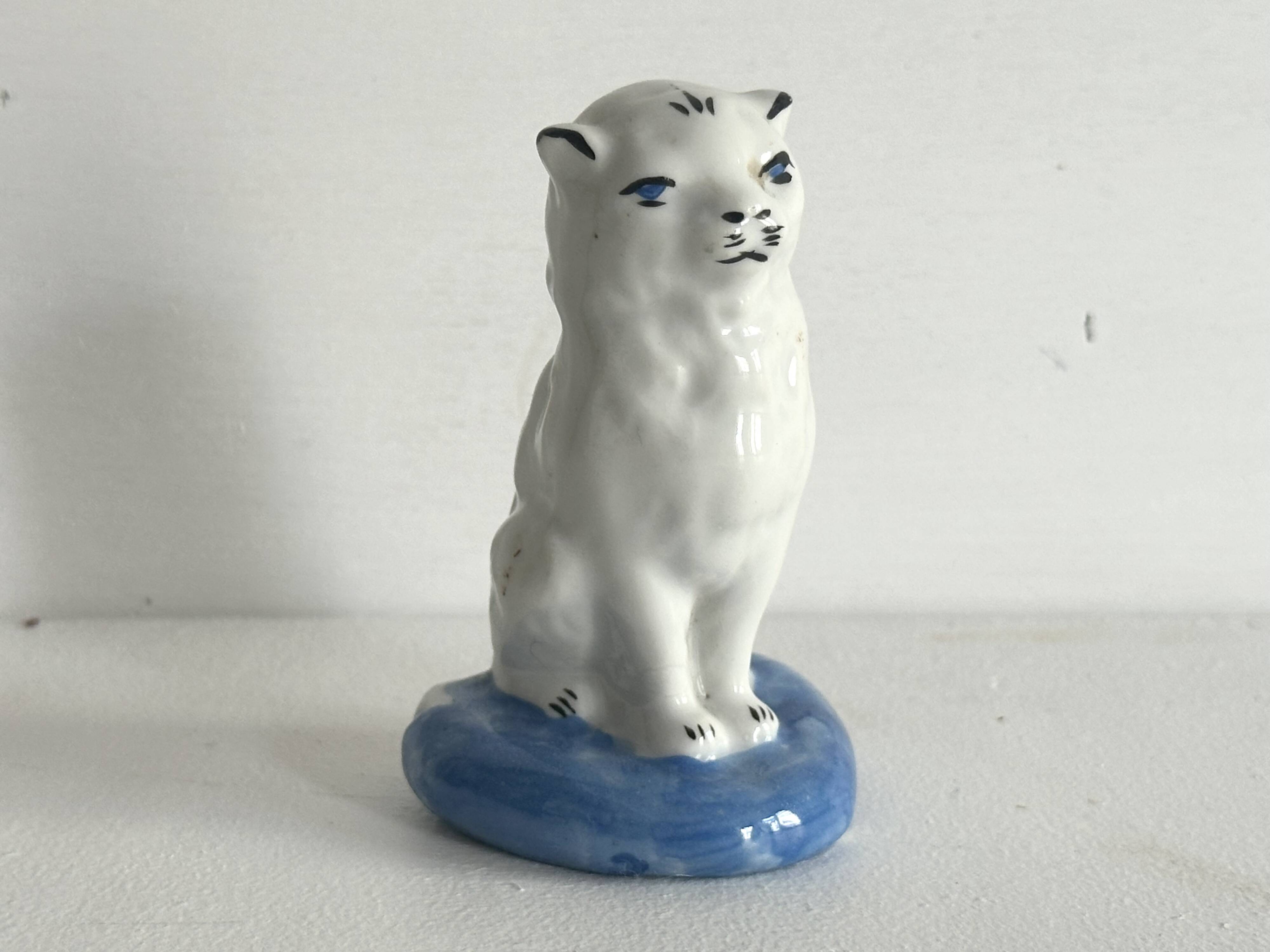 Small ancient glazed ceramic cat from the 19th century.