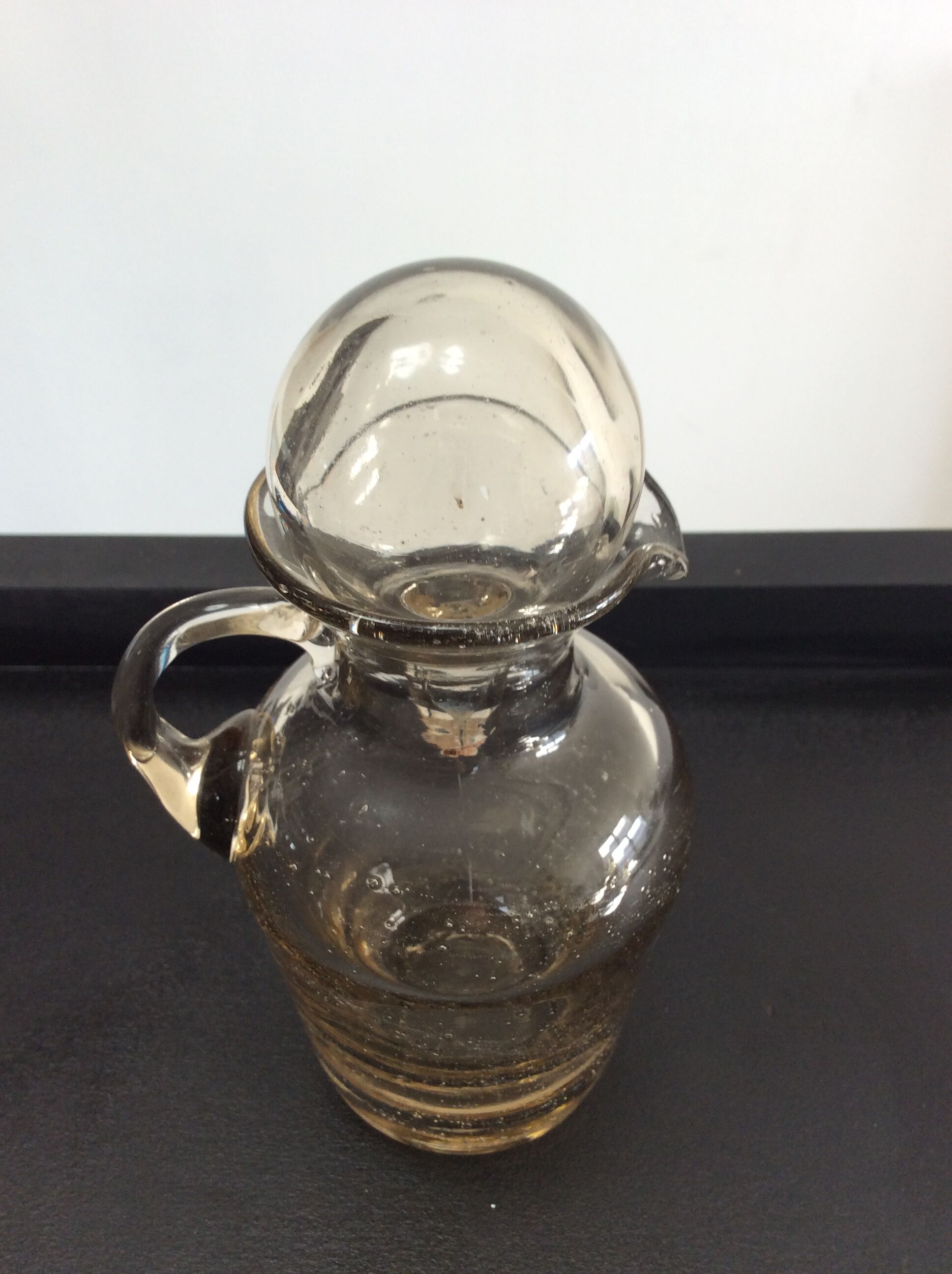Vintage decanter made of blown glass paste
