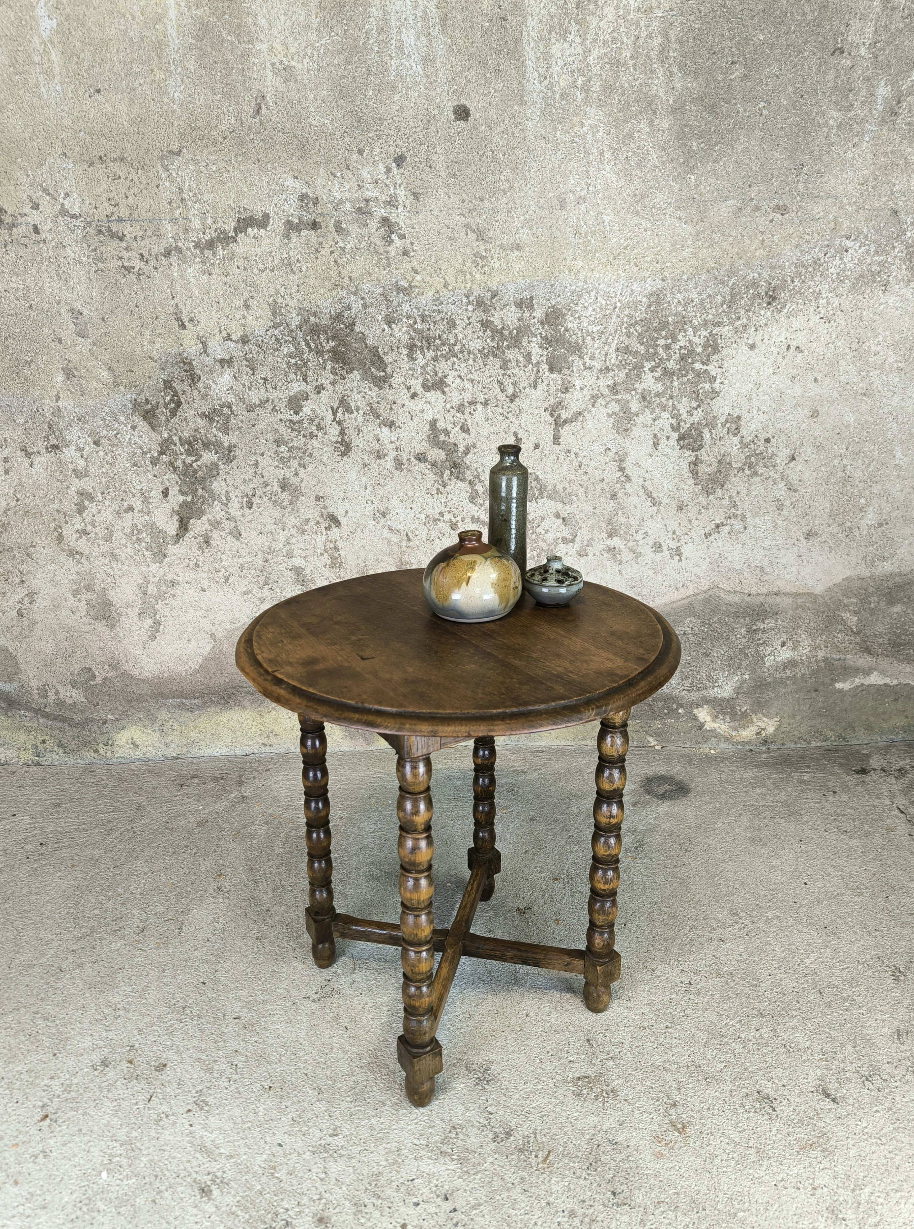 Vintage gueridon with beaded wooden legs.