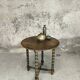 Vintage gueridon with beaded wooden legs.