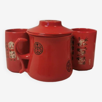 Tisanière et deux tasses en céramique rouge et noire, motif asiatique