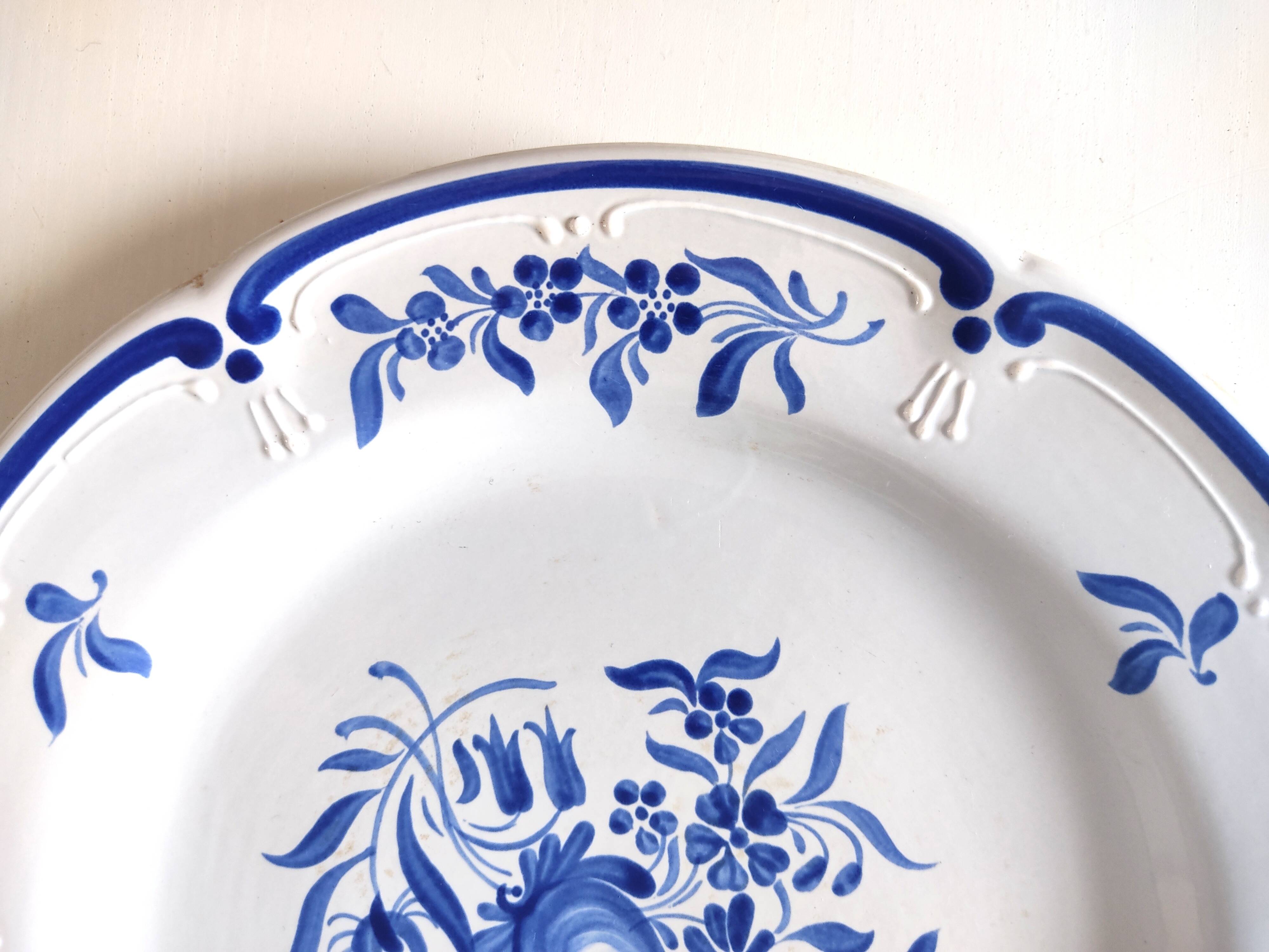 Decorative blue and white earthenware plate