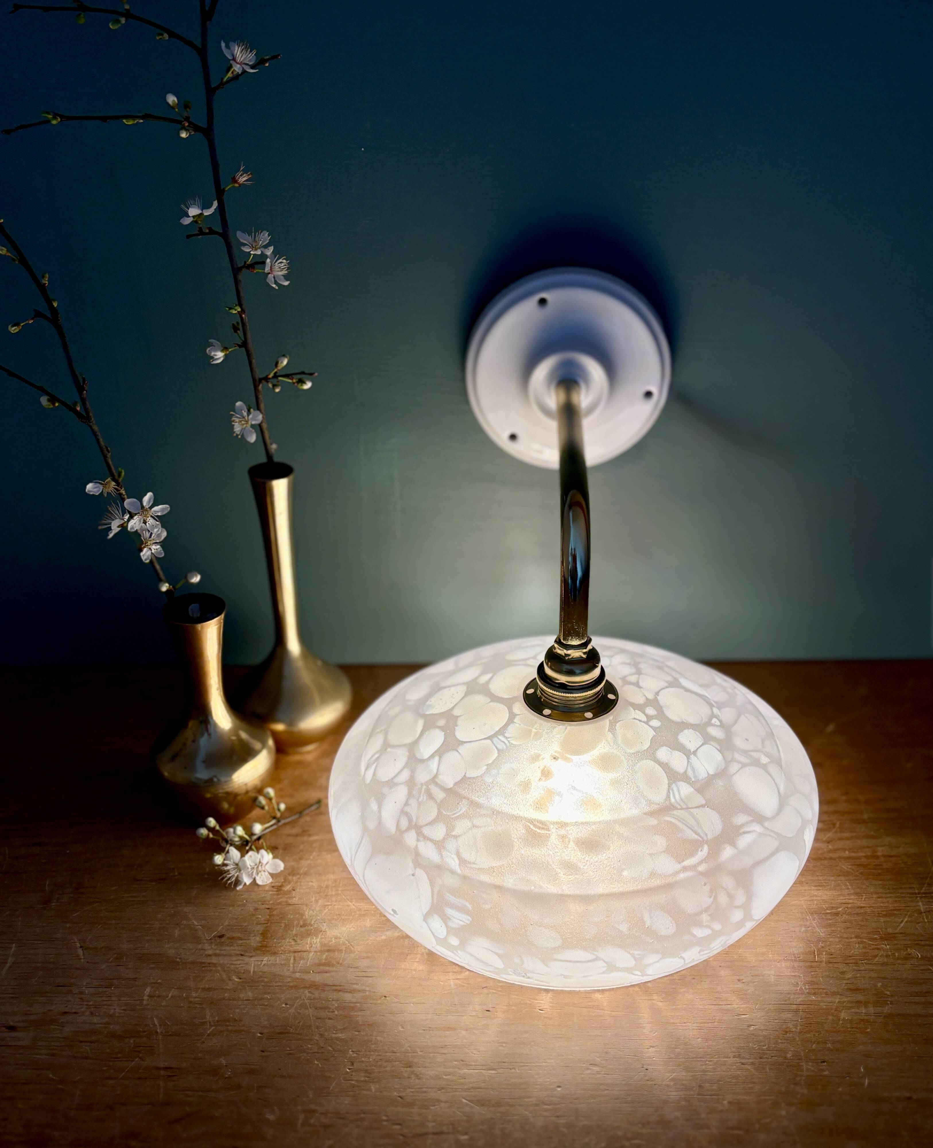Vintage glass wall lamp with a white Clichy shade.