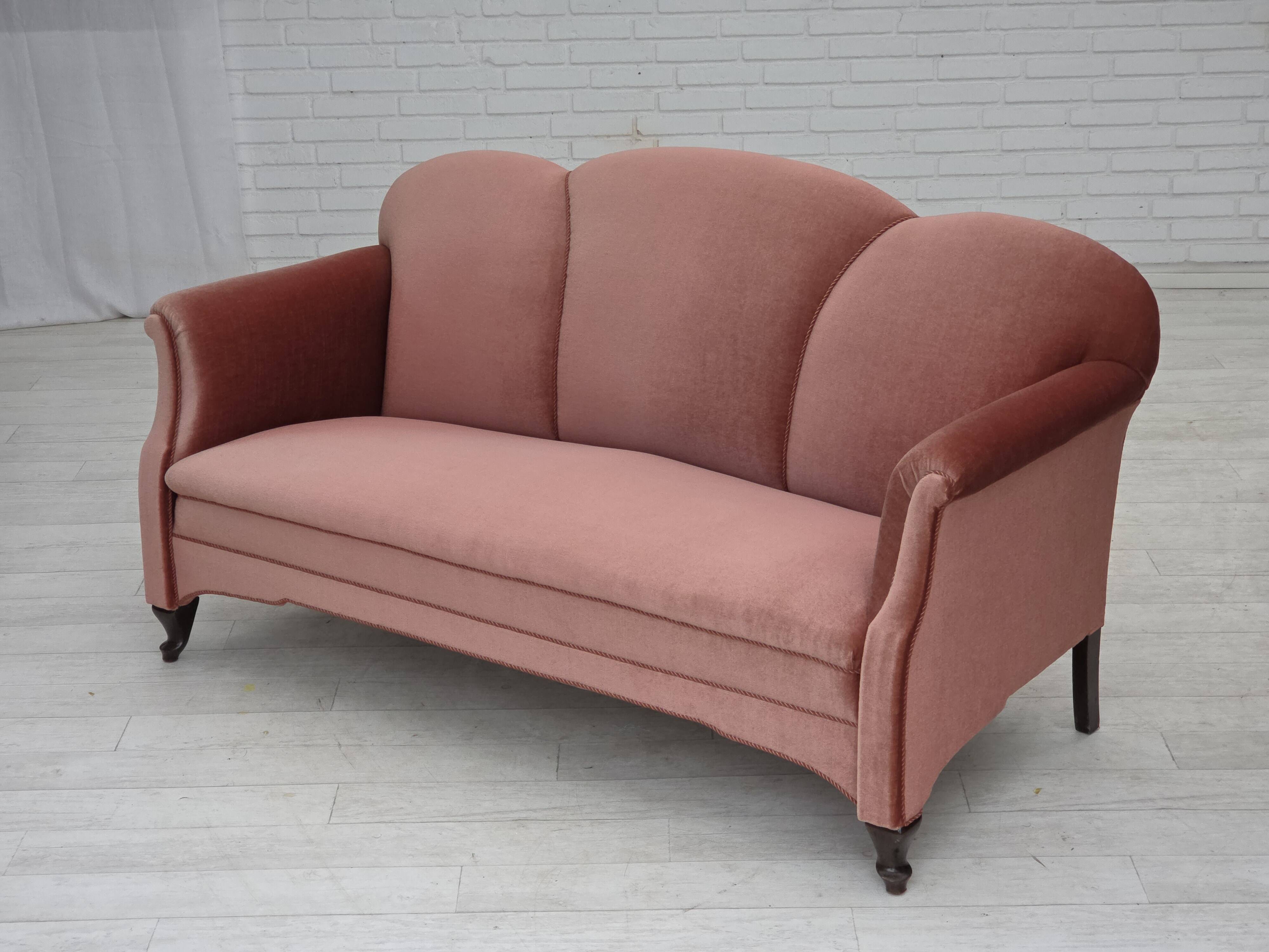 1950s, Danish 2-seater sofa, salmon pink furniture velour, oak wood legs.
