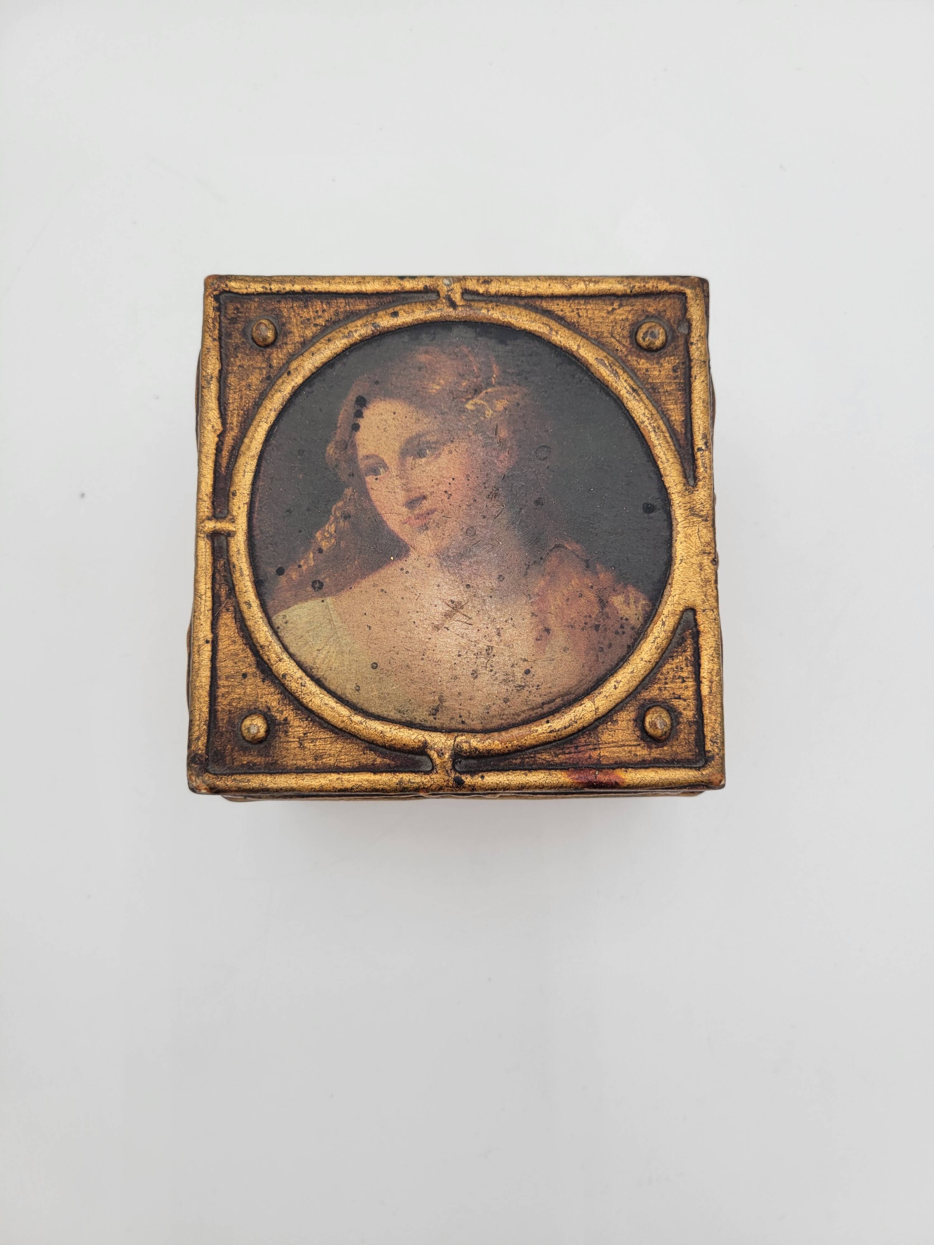 Old jewelry box in wood and gilded stucco