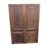 Paire de portes anciennes en bois sculptées