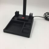 Duo of red and black flexible desk lamps with pencil holder