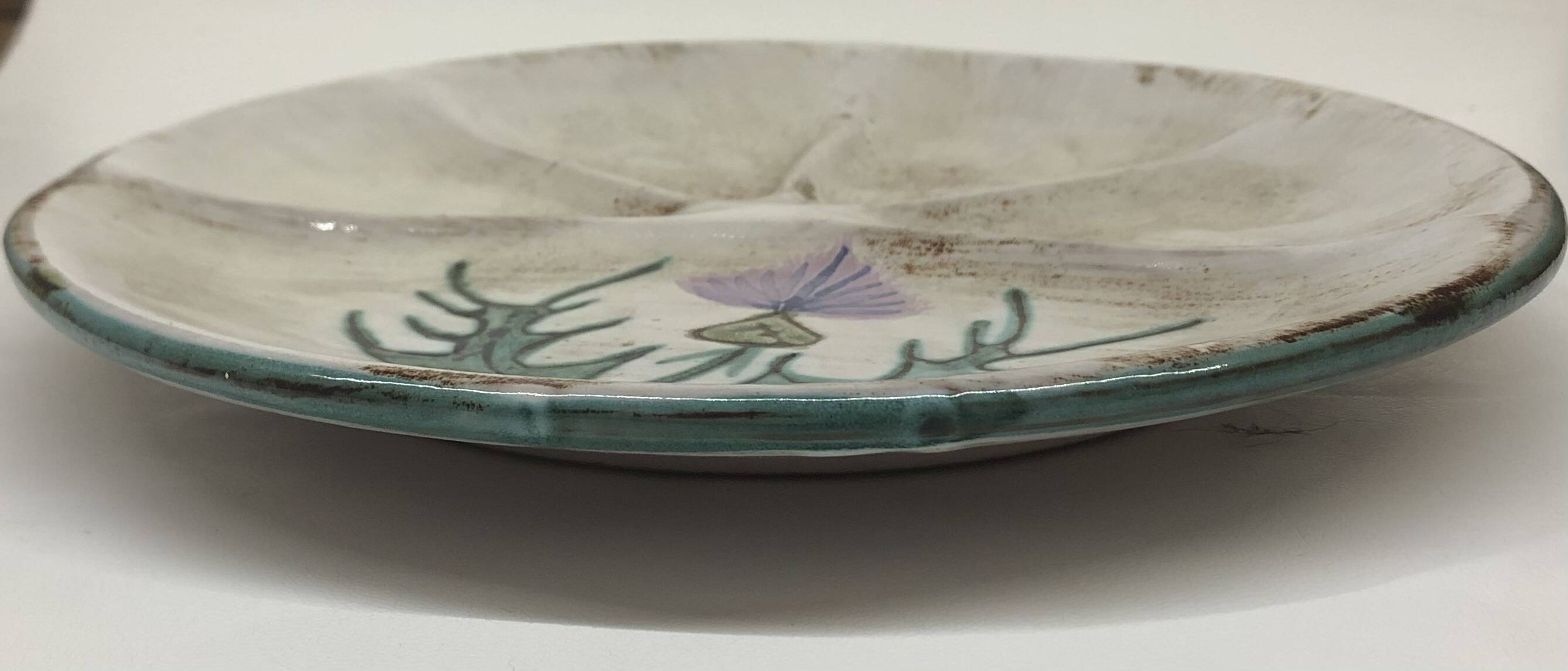 Thistle-themed decorative plate by Daniel Étienne in Vallauris
