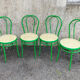 Lot de quatre chaises bistrot en métal laqué vert