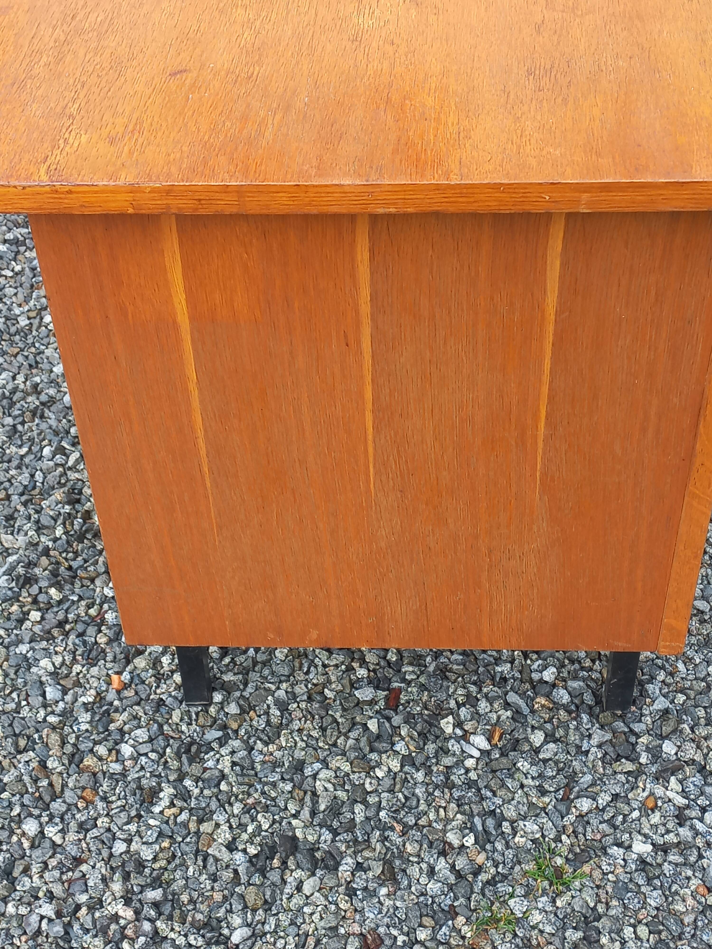 Vintage oak desk with a metallic base from the 1960s.