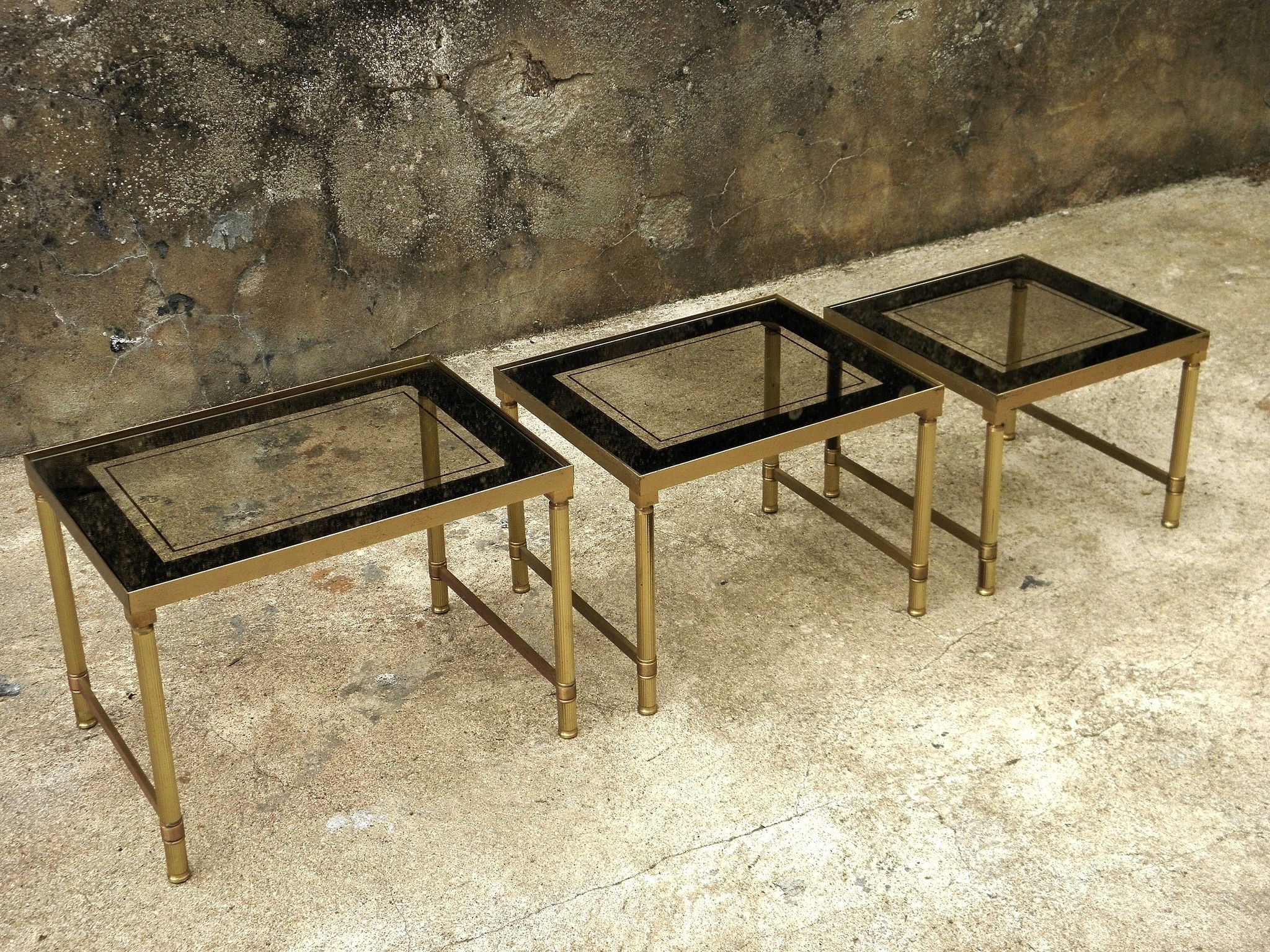 Brass, gold metal and 70s mirror glass tables