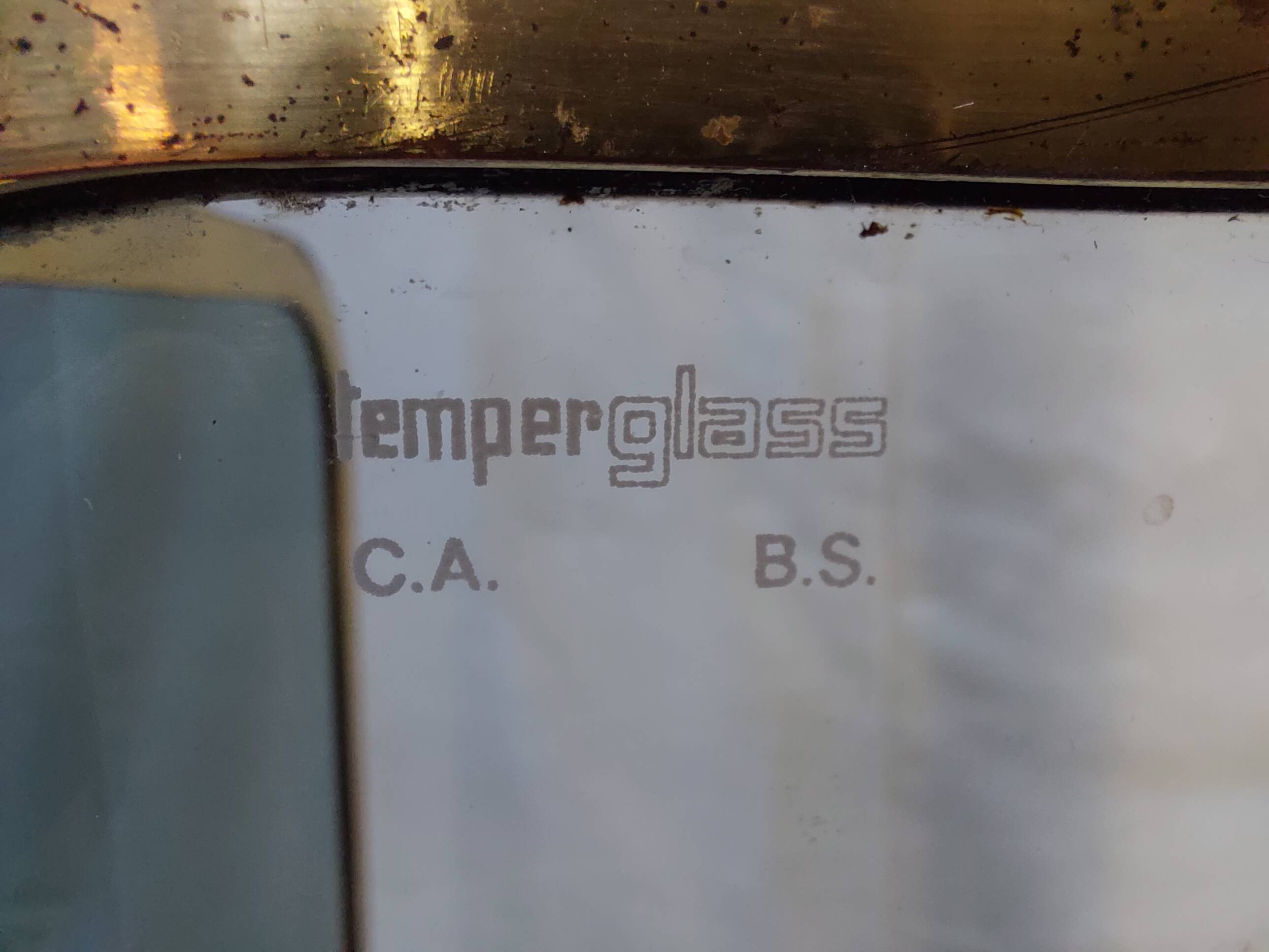 Vintage fireplace screen in smoked glass and gold-tone metal