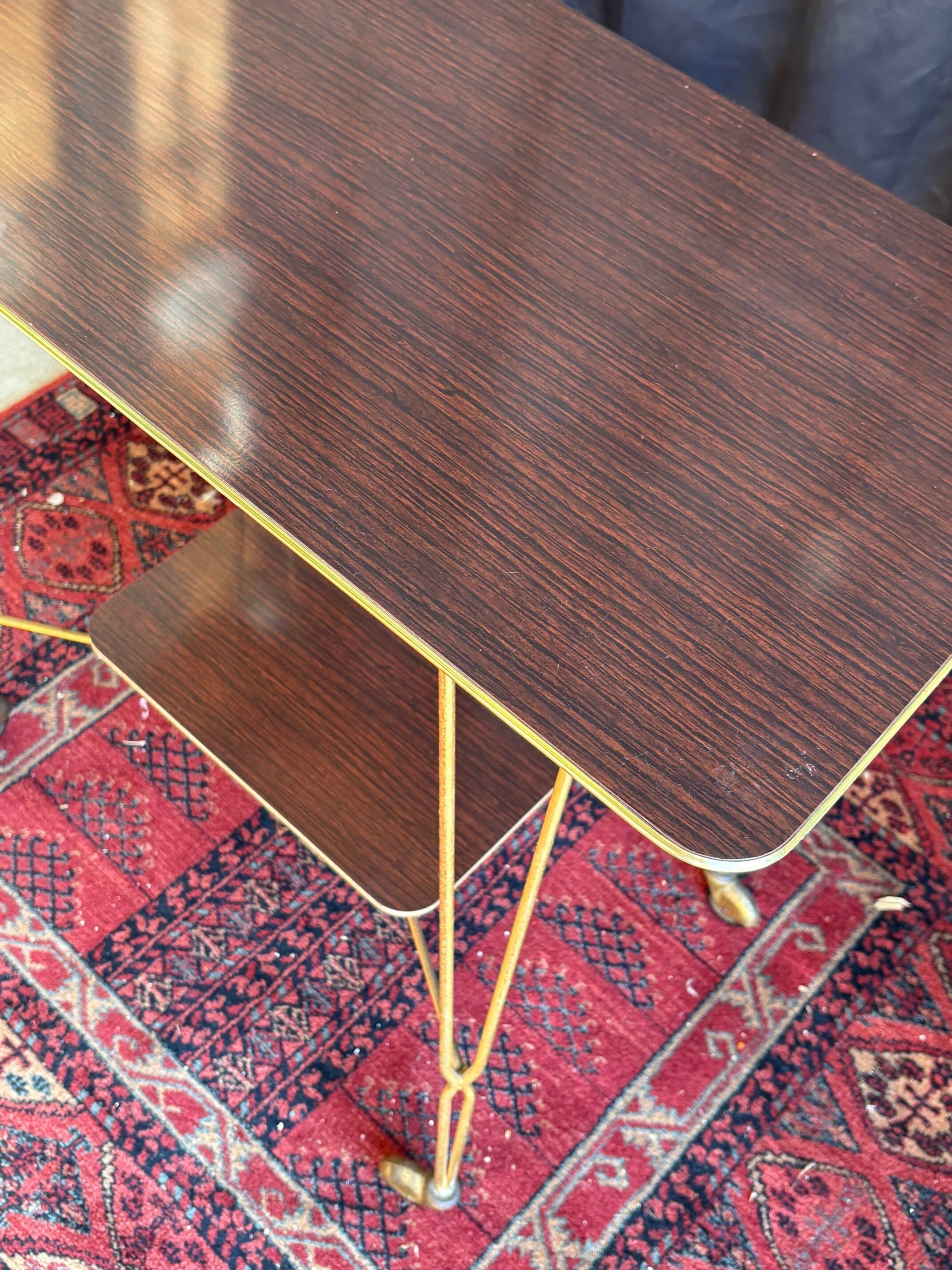 Vintage 1960s rolling dessert trolley in gold metal and formica.