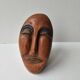 Terracotta face sculpture in African art style