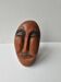 Sculpture visage en terre cuite style art africain