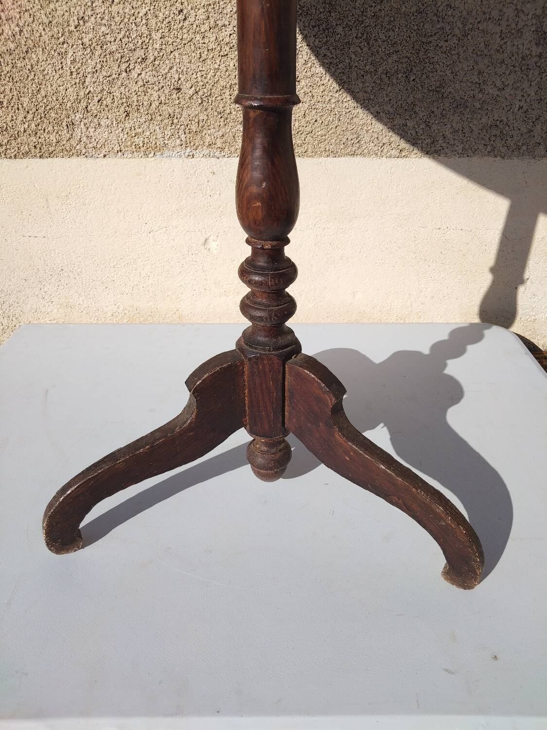Small rustic antique tripod side table made of solid wood.
