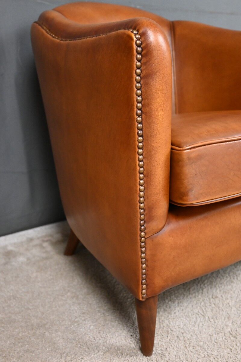 Pair of Solange club armchairs in sheepskin leather – reproduction