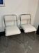 Pair of chrome chairs upholstered in boucle fabric.
