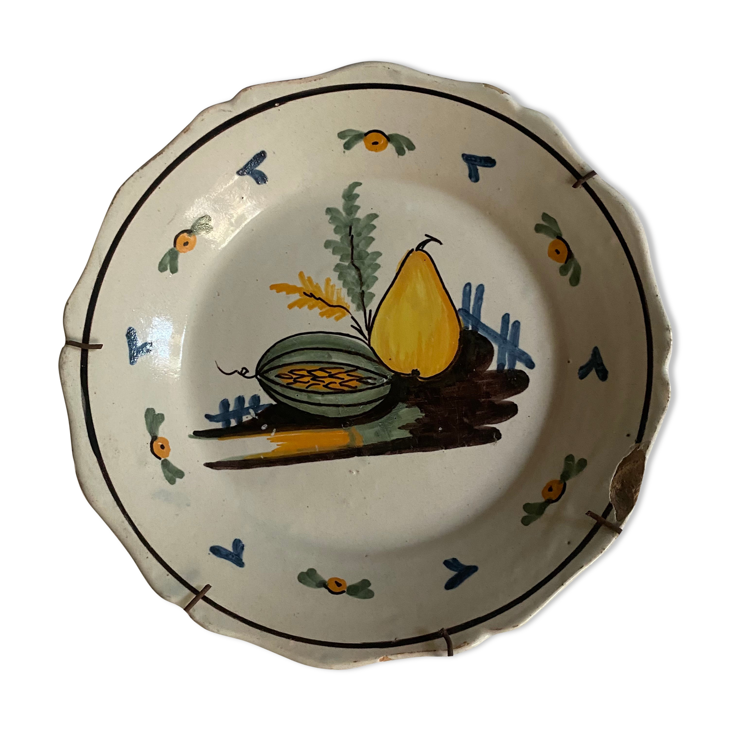 Plate of Nevers in earthenware late eighteenth century decoration with pear