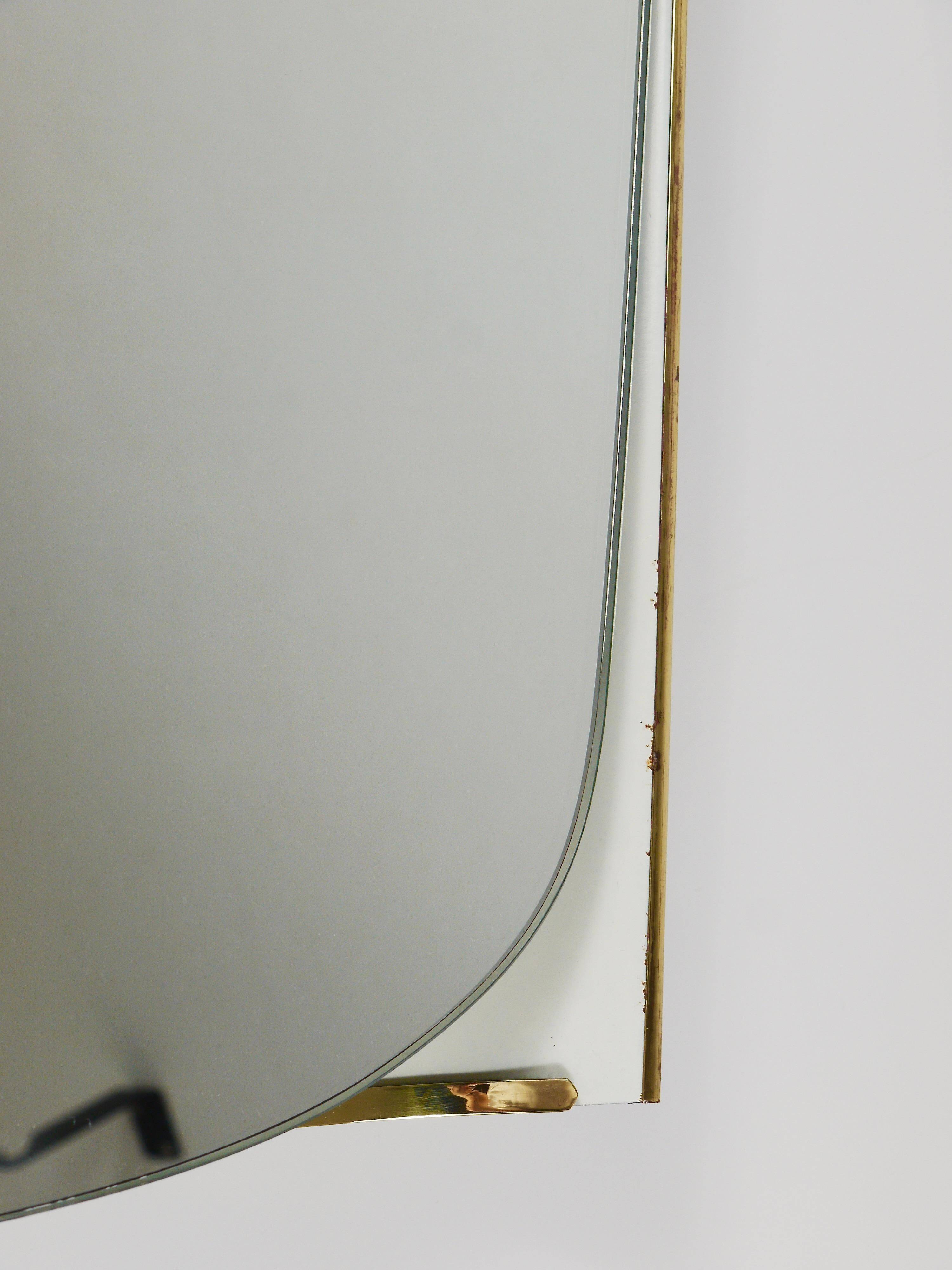 Mid-century illuminated wall mirror by Ernest Igl with brass crown, by Hillebrand.