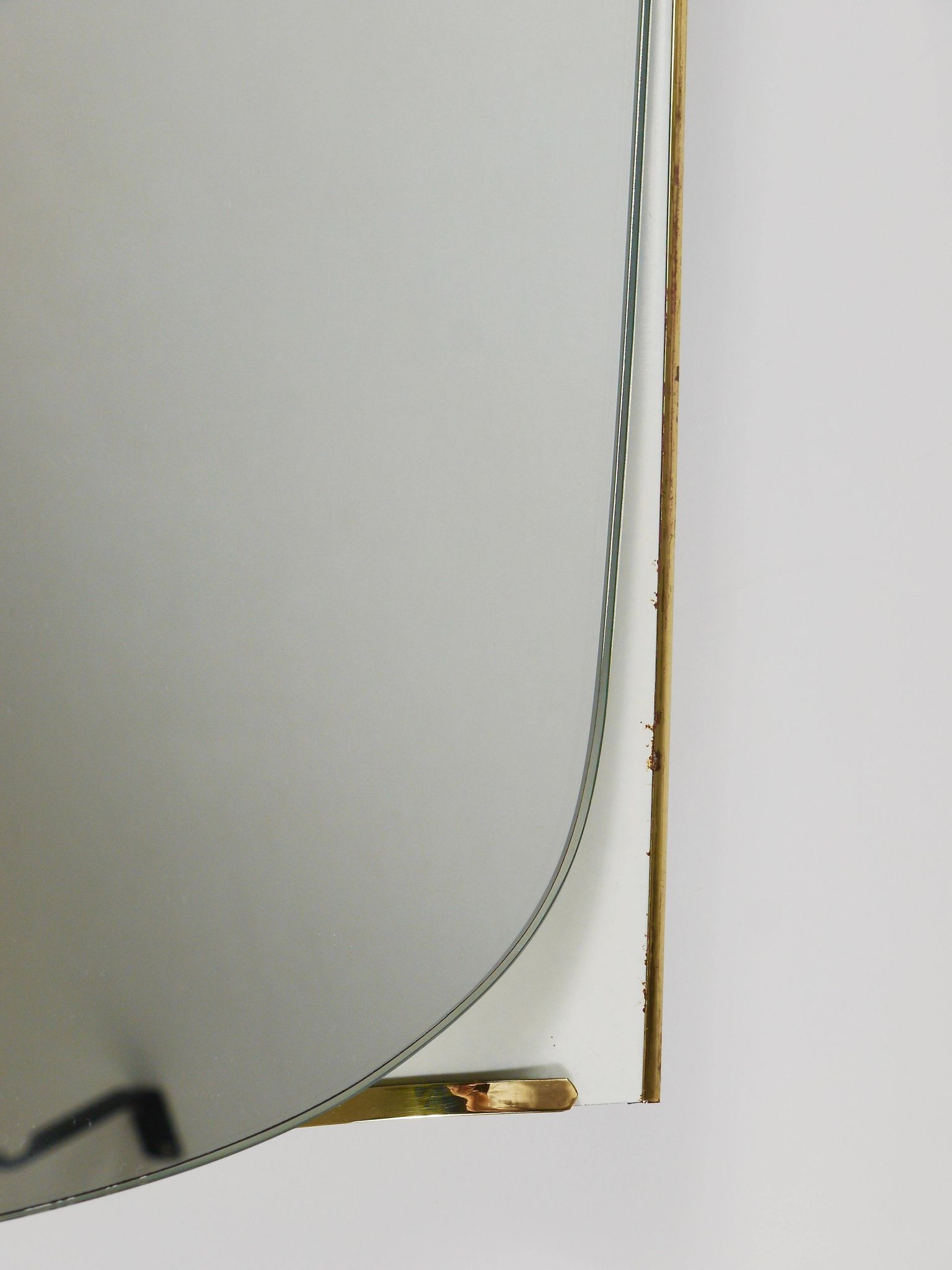 Mid-century illuminated wall mirror by Ernest Igl with brass crown, by Hillebrand.