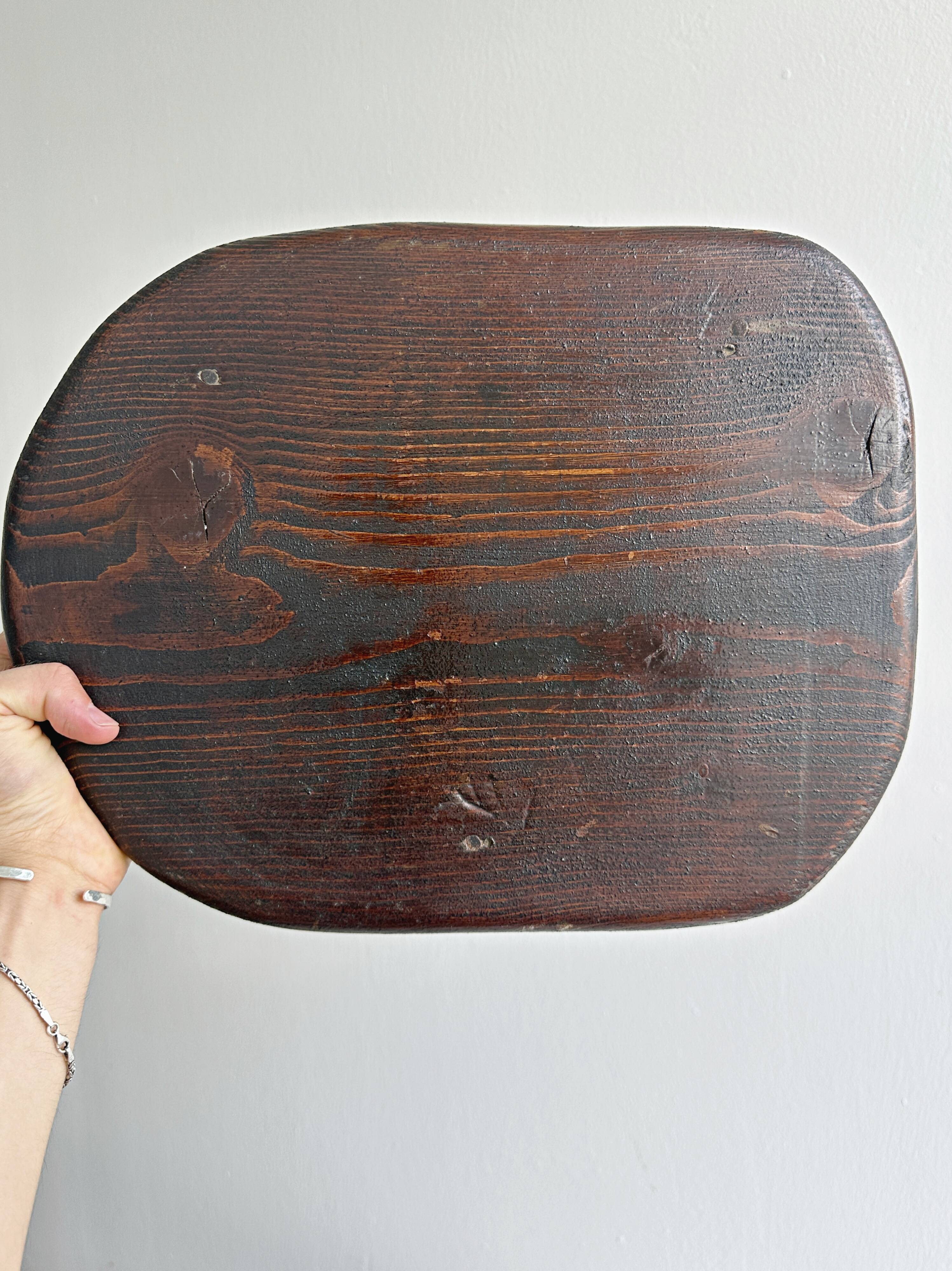 Antique dark wood tripod stool